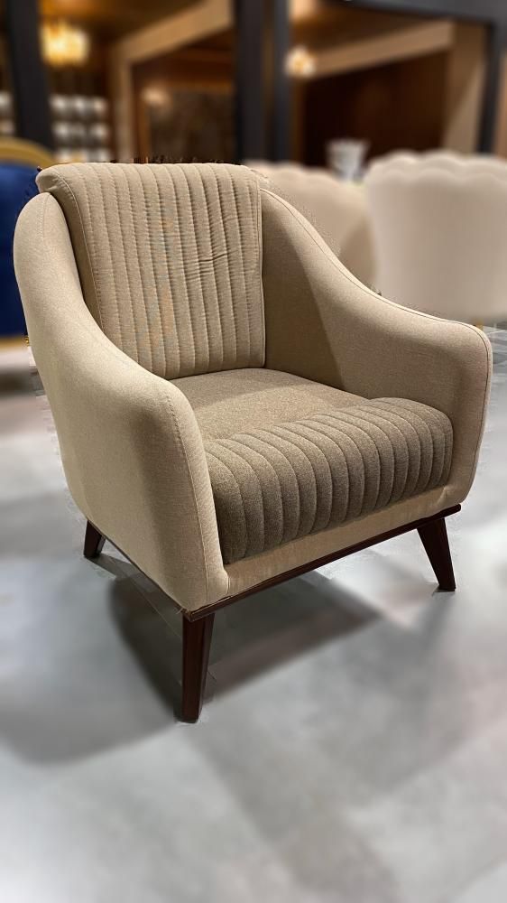 Beige channel-back armchair